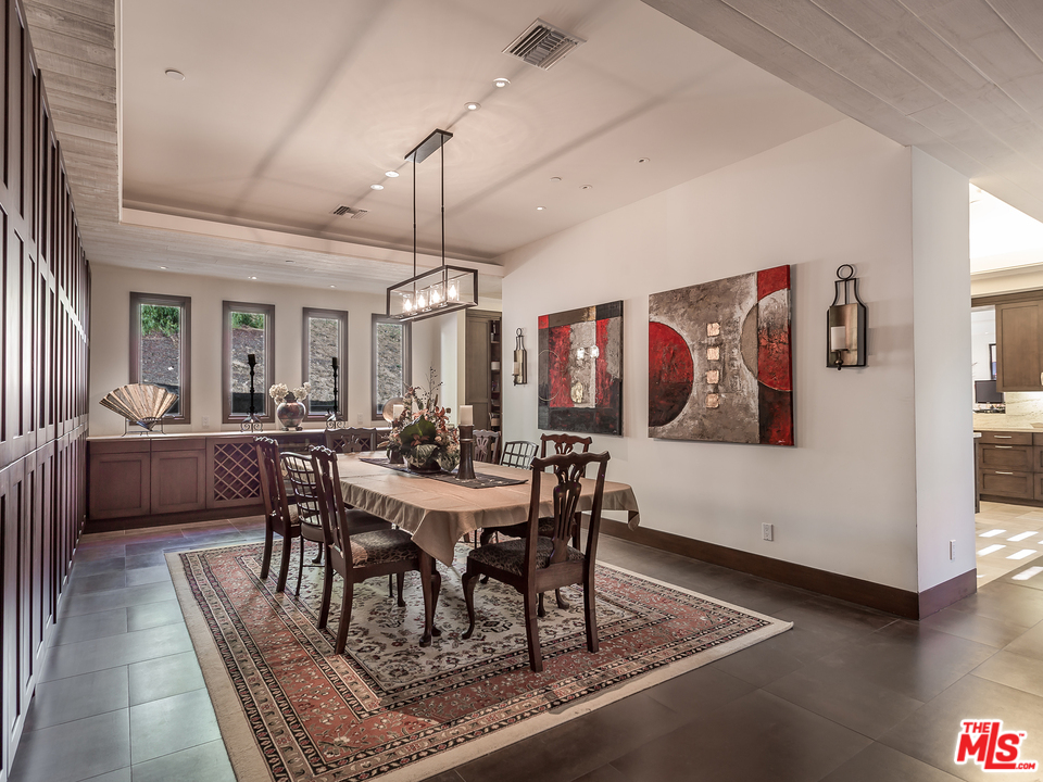24754 Robert Guy Road Hidden Hills, CA 91302 - Photo 5 of 18 a view of a dining room with furniture