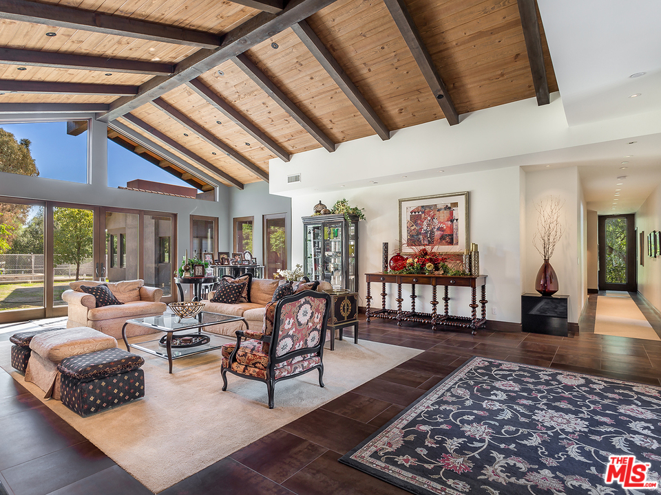 24754 Robert Guy Road Hidden Hills, CA 91302 - Photo 7 of 18 a living room with furniture and wooden floor