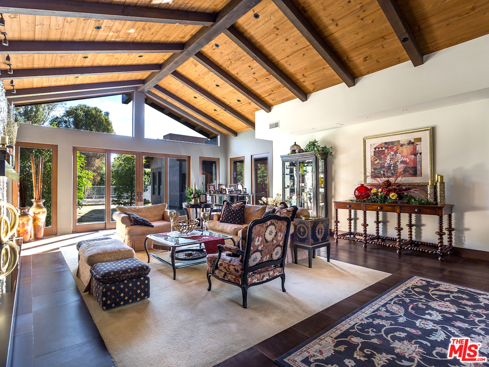 24754 Robert Guy Road Hidden Hills, CA 91302 - Photo 9 of 18 a living room with furniture and a large window