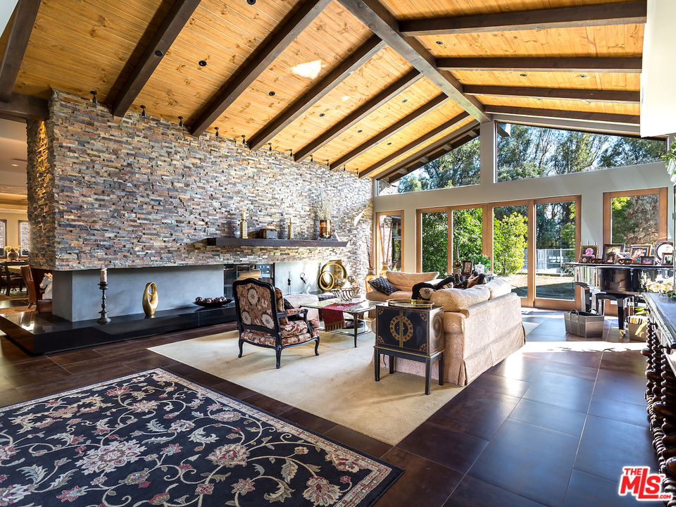24754 Robert Guy Road Hidden Hills, CA 91302 - Photo 10 of 18 a living room with furniture and a large window
