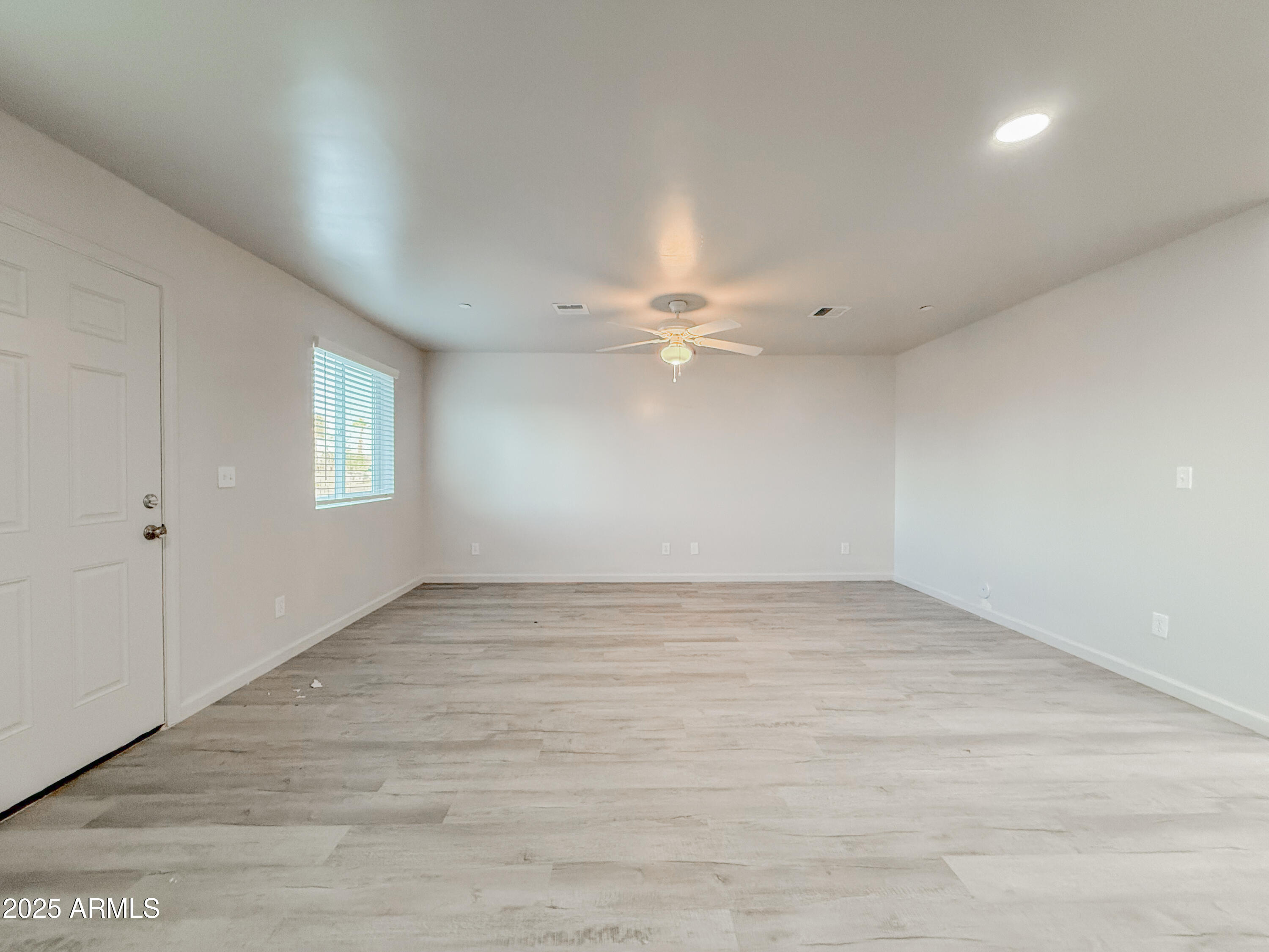 2121 West Adams Street, Unit A103 Phoenix, AZ 85009 - Photo 11 of 22 a view of an empty room with a window