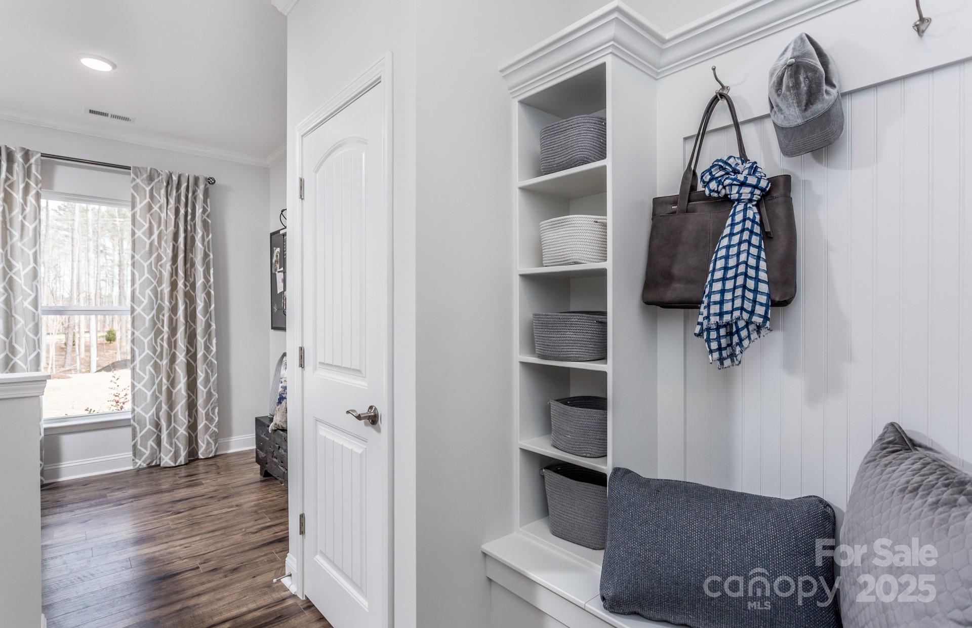 4741 Formation Court, Unit 43 Lancaster, SC 29720 - Photo 2 of 9 a hallway with front door wooden floor and windows