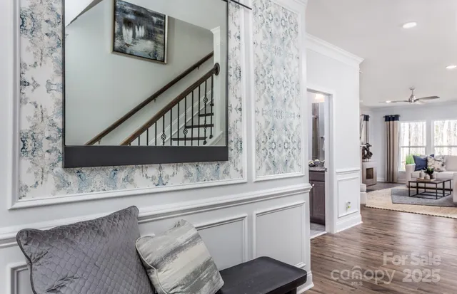 a living room with stainless steel appliances kitchen island granite countertop furniture and a kitchen view