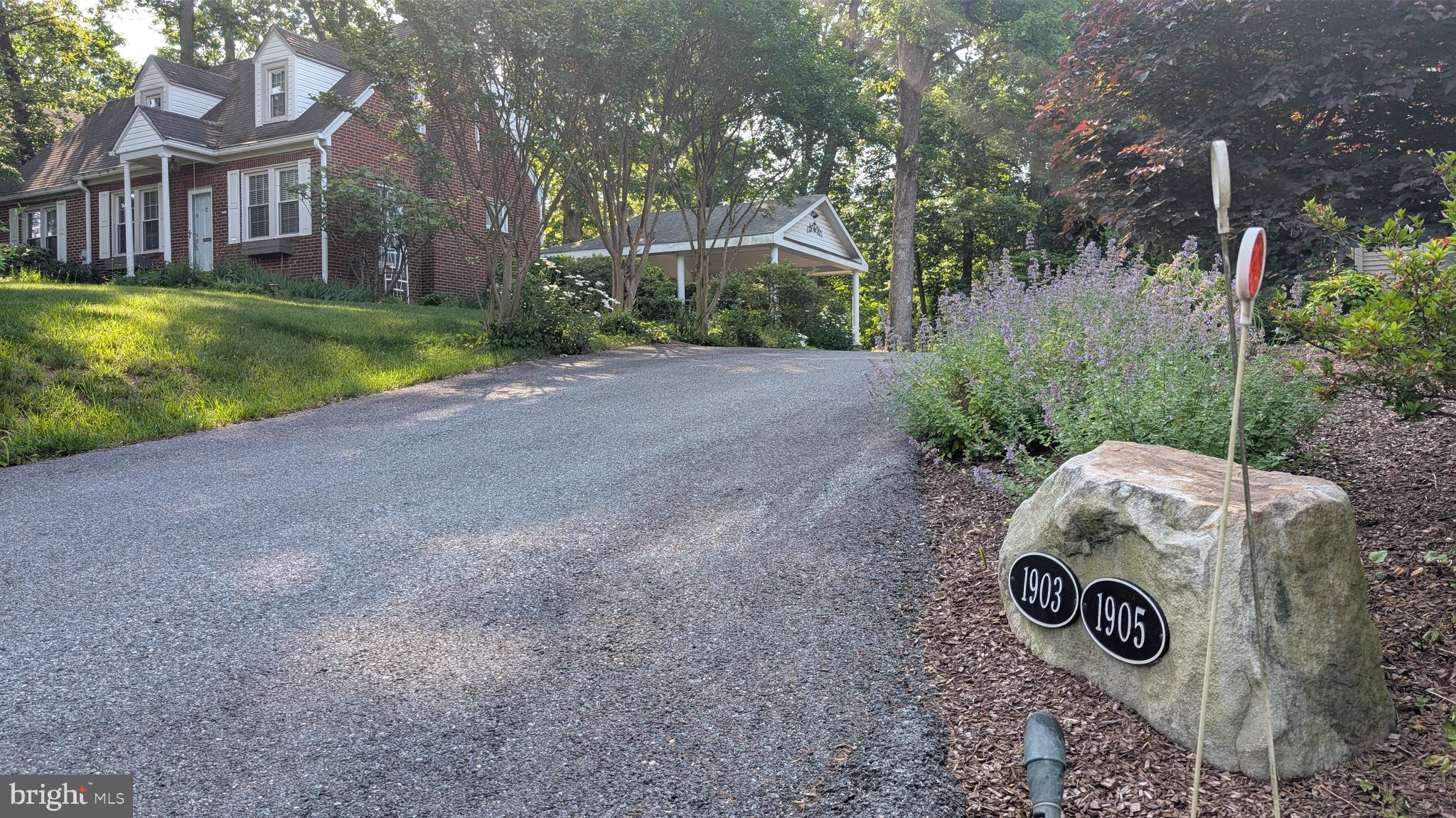 1903 Kirby Road McLean, VA 22101 - Photo 1 of 11 a view of a house with backyard and trees
