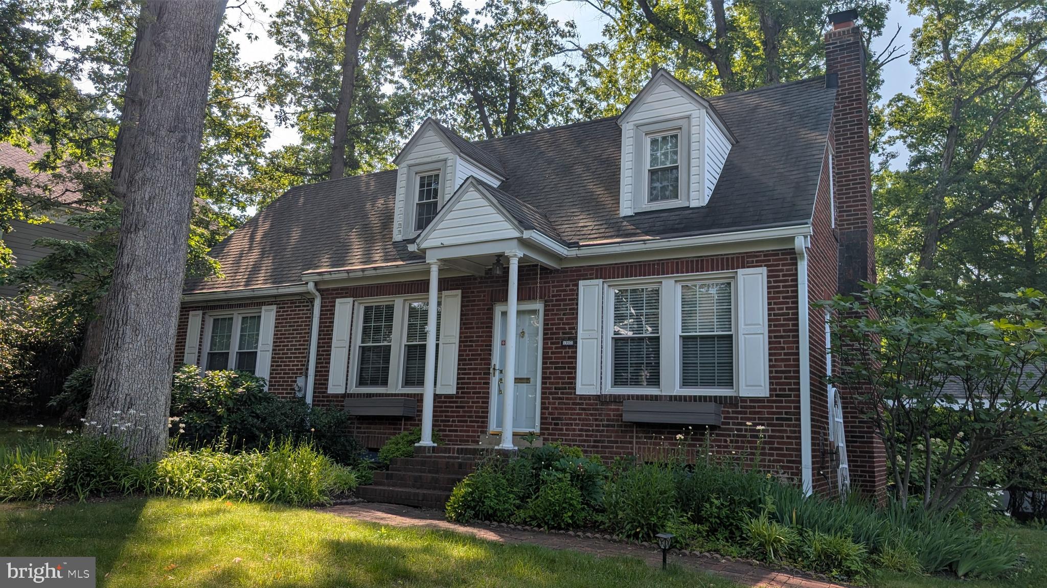 1903 Kirby Road McLean, VA 22101 - Photo 5 of 11 a front view of a house with garden