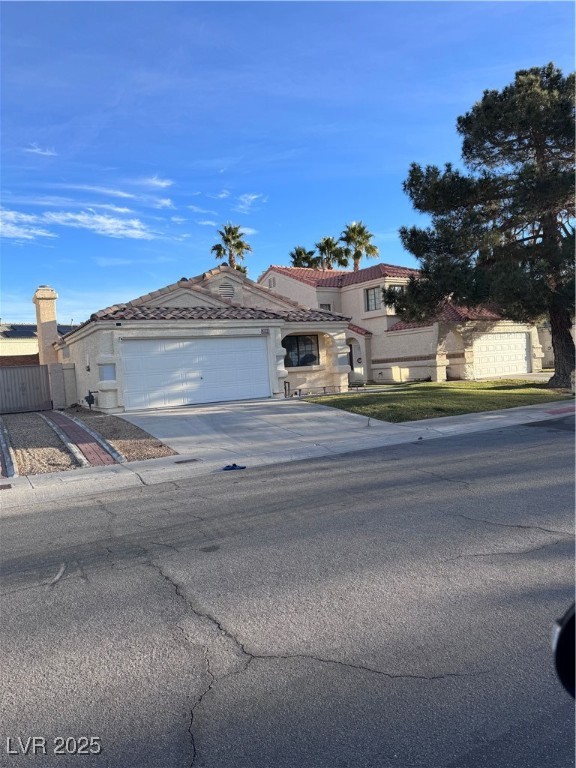 2044 Waverly Circle Henderson, NV 89014 - Photo 1 of 14 View of front facade featuring concrete driveway,