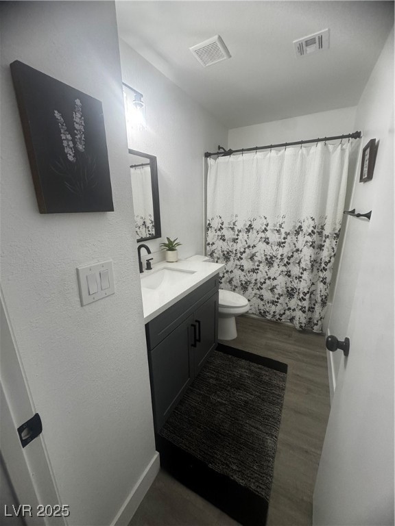 2044 Waverly Circle Henderson, NV 89014 - Photo 4 of 14 Full bathroom with toilet, wood finished floors, v