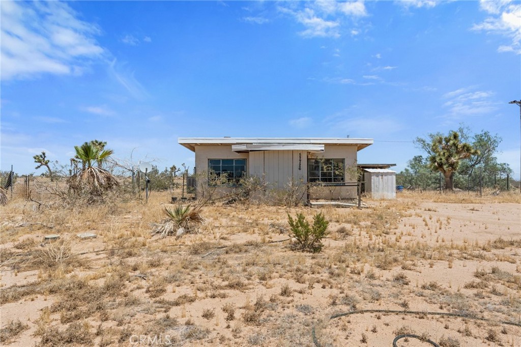 57726 Starlight Mesa Road Yucca Valley, CA 92284 - Photo 1 of 1 a view of a house with a yard