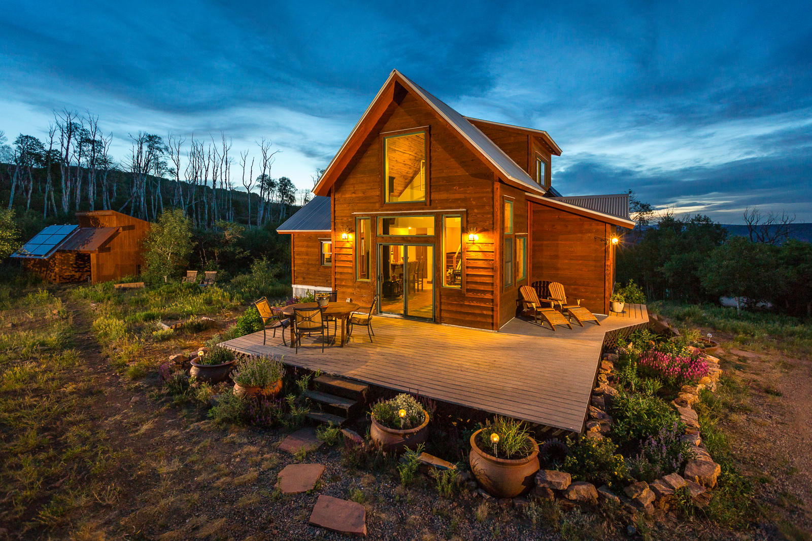 799 Harcourt Trail Placerville, CO 81430 - Photo 2 of 29 a view of backyard with swimming pool and outdoor seating