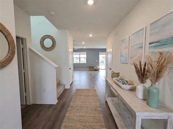 a kitchen with stainless steel appliances granite countertop a sink a stove top oven a counter space and cabinets