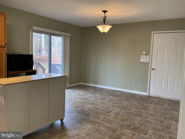 a kitchen with stainless steel appliances granite countertop a refrigerator stove a sink and dishwasher