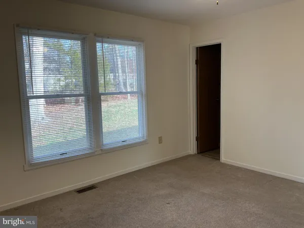 a bathroom with a shower and a toilet