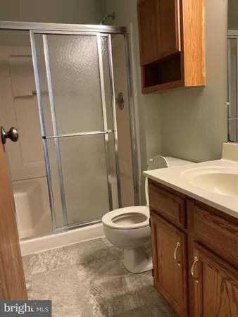a bathroom with a toilet and a bath tub