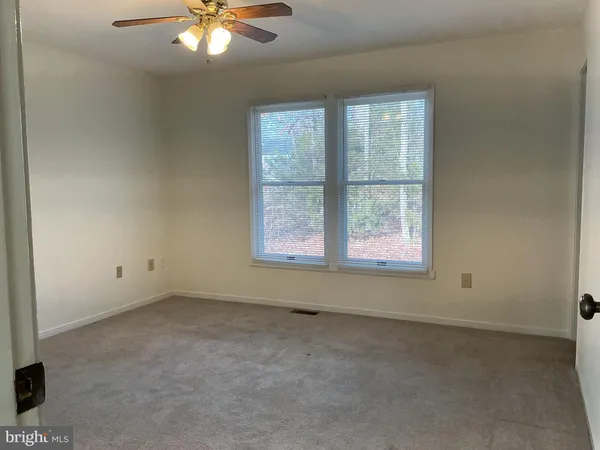 a bathroom with a toilet a sink and a shower