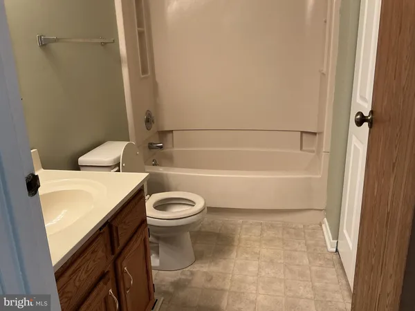 a view of a wooden chairs on the deck