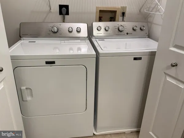 a view of a house with a yard and wooden floor