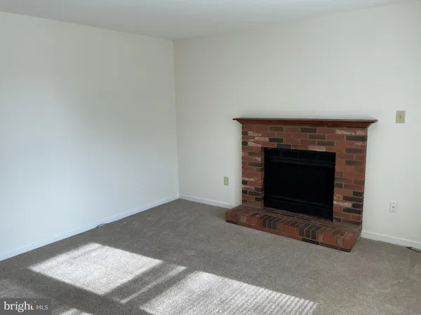 a kitchen with a refrigerator sink and cabinets
