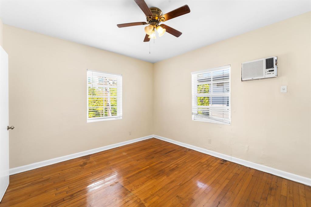1241 13th Street, Unit 4 Miami Beach, FL 33139 - Photo 13 of 19 wooden floor in an empty room with a window