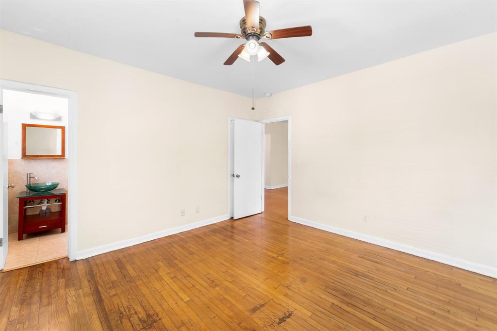 1241 13th Street, Unit 4 Miami Beach, FL 33139 - Photo 9 of 19 a view of an empty room with wooden floor