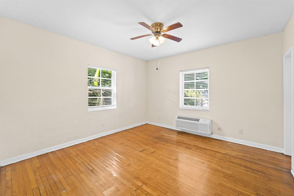 1241 13th Street, Unit 4 Miami Beach, FL 33139 - Photo 10 of 19 wooden floor in an empty room with a window