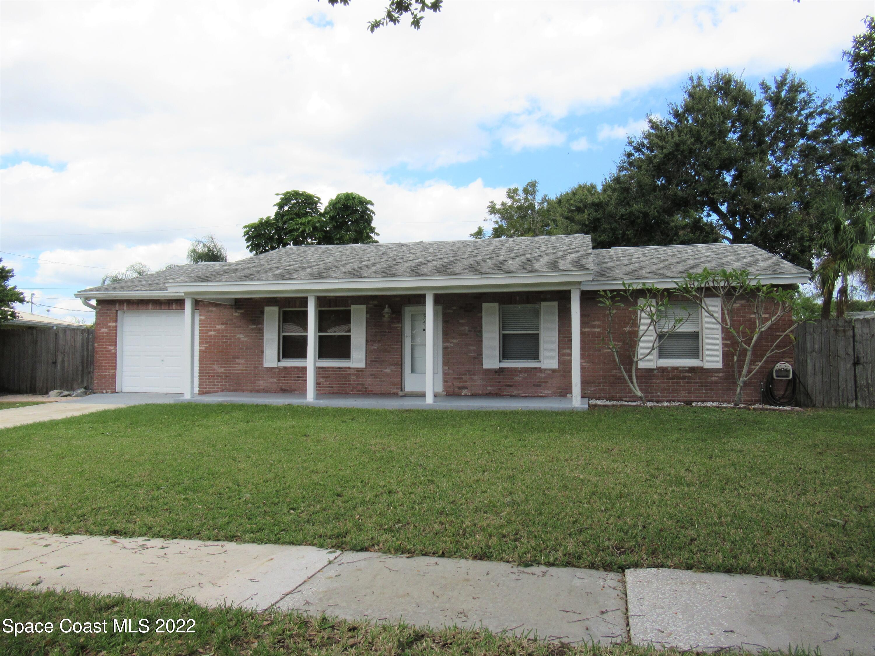 974 Bucknell Place Rockledge, FL 32955 - Photo 1 of 30 front view of a house with a garden