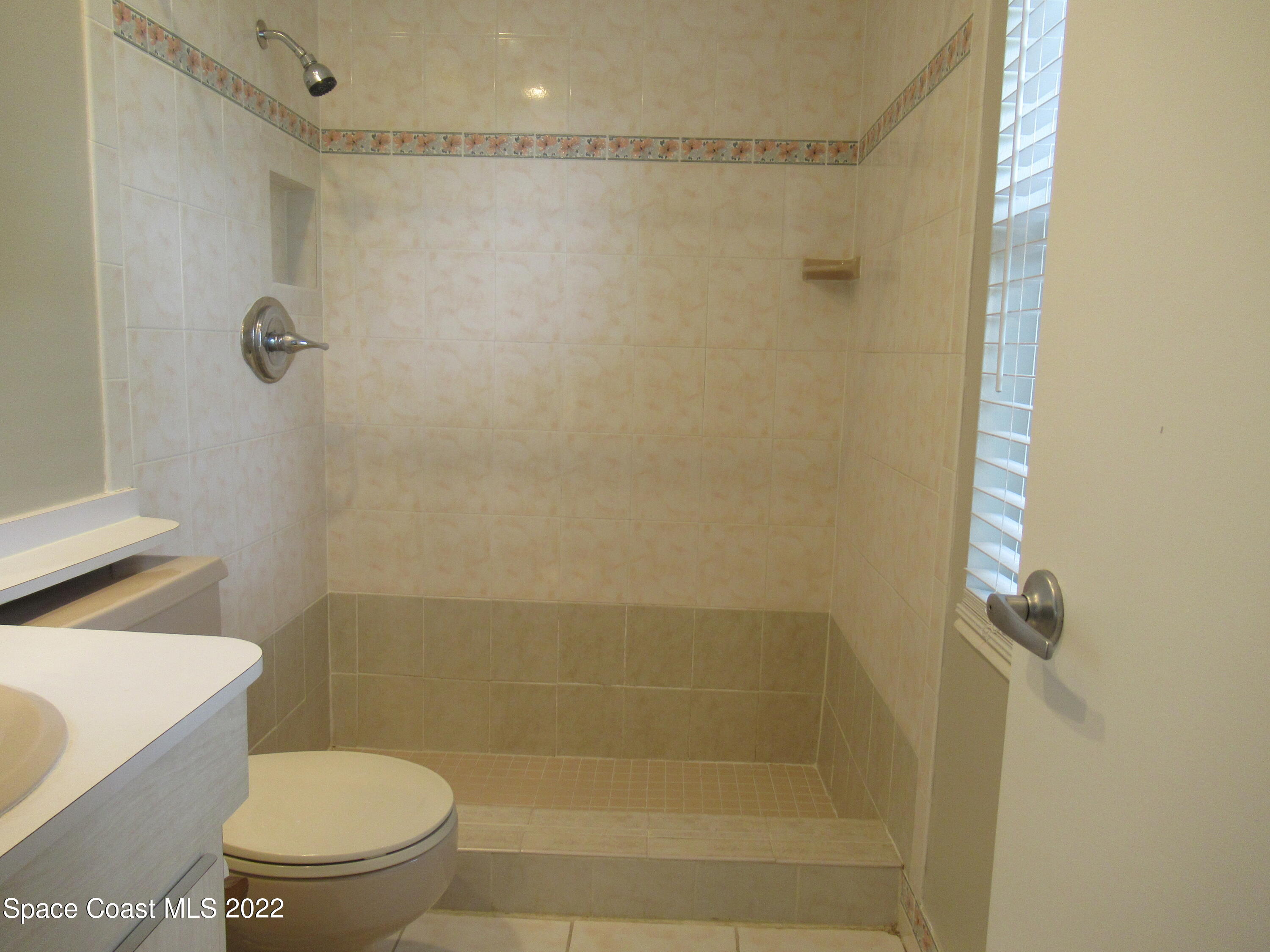 974 Bucknell Place Rockledge, FL 32955 - Photo 15 of 30 a bathroom with a shower and a toilet