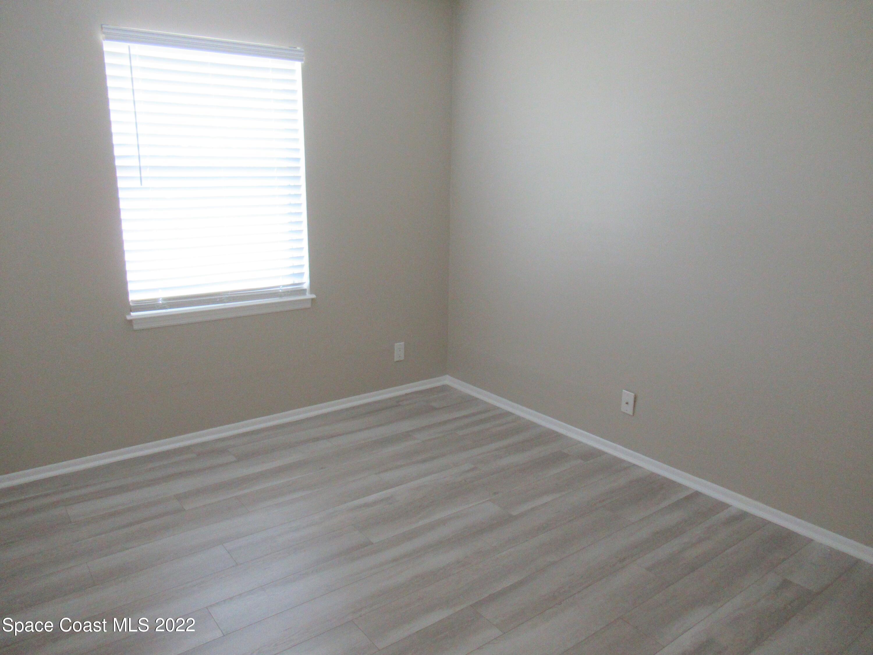974 Bucknell Place Rockledge, FL 32955 - Photo 18 of 30 an empty room with a window