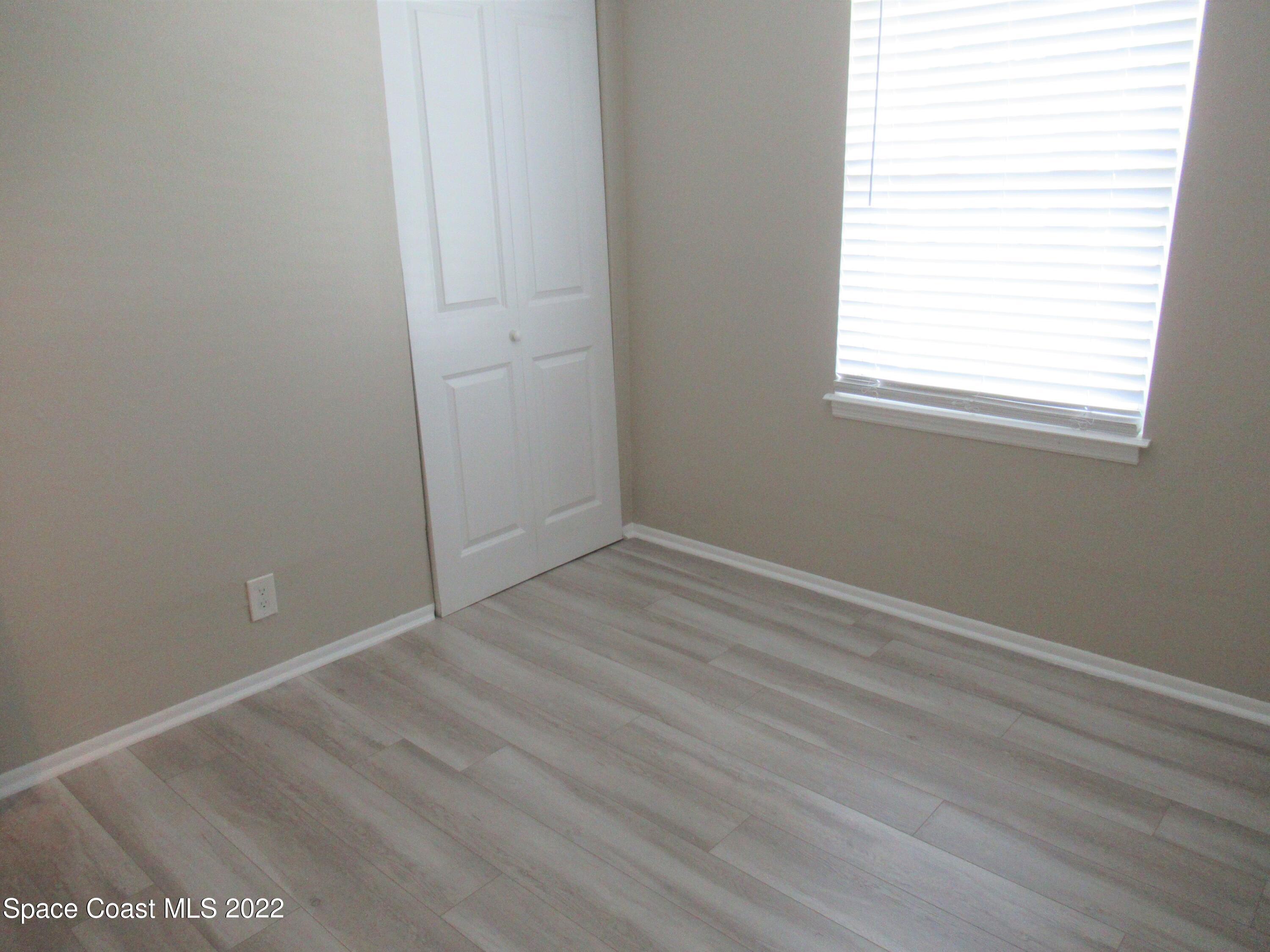 974 Bucknell Place Rockledge, FL 32955 - Photo 19 of 30 an empty room with a window