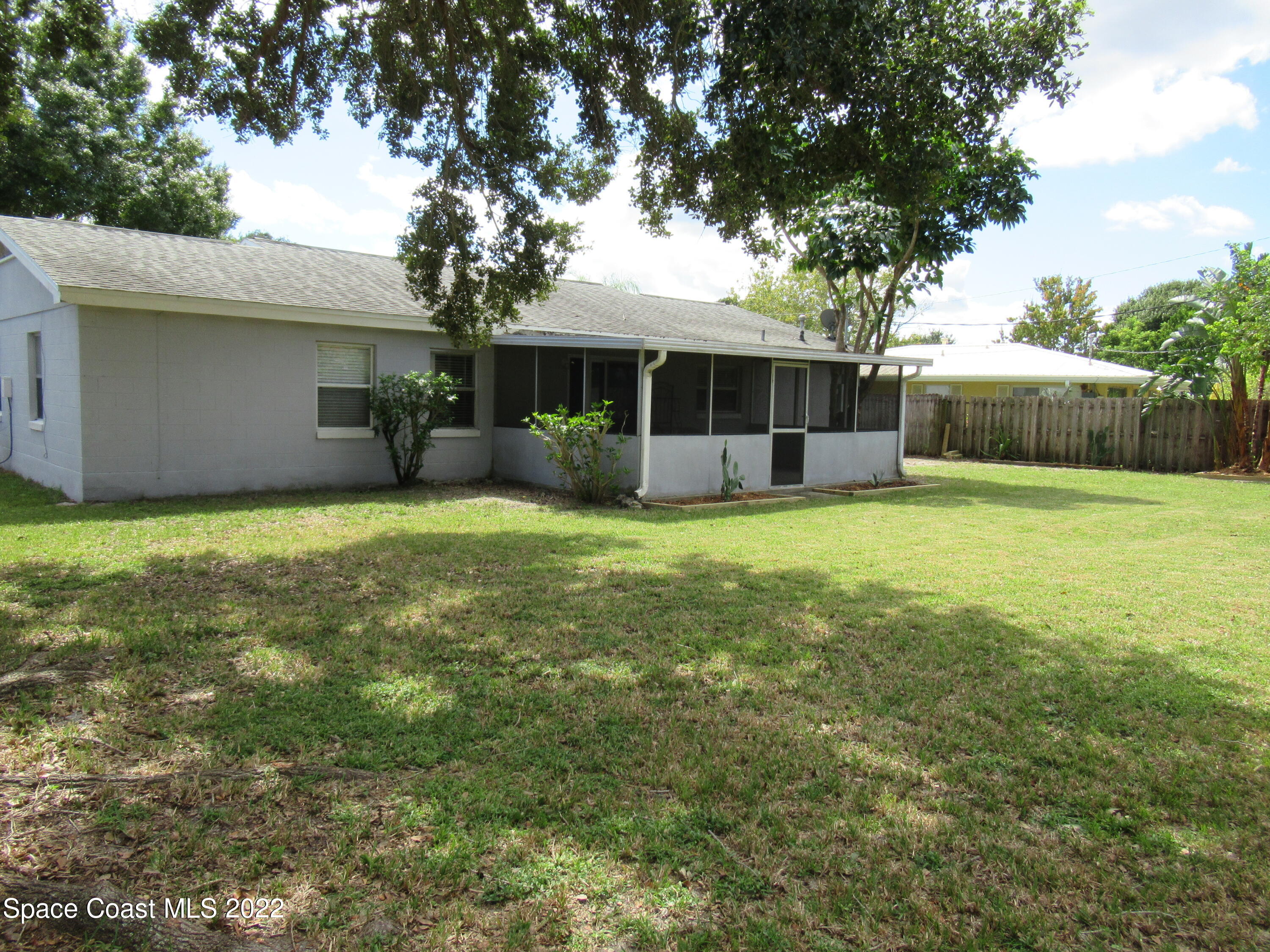 974 Bucknell Place Rockledge, FL 32955 - Photo 28 of 30 a view of a house with a yard and sitting area