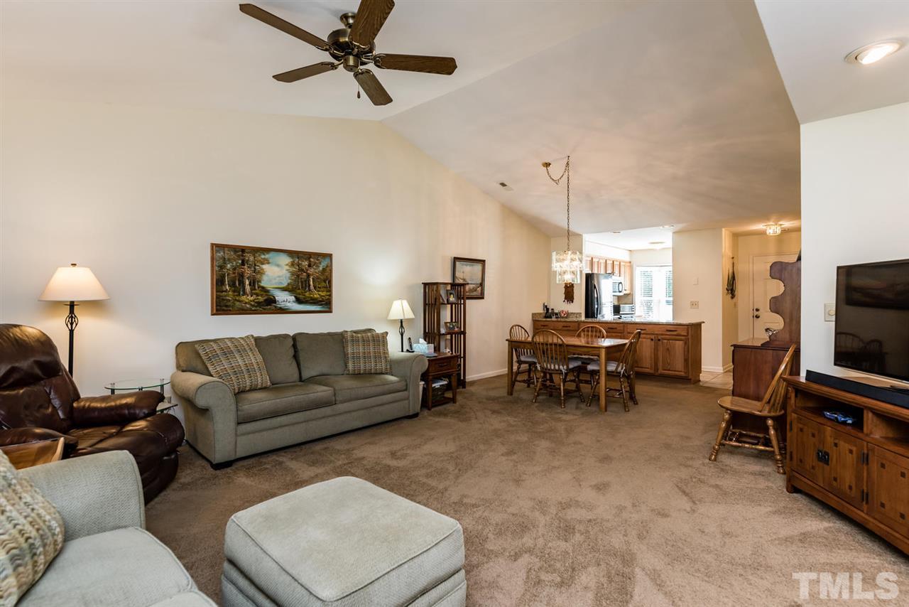 2603 Cottage Circle Raleigh, NC 27613 - Photo 16 of 25 a living room with furniture and a flat screen tv