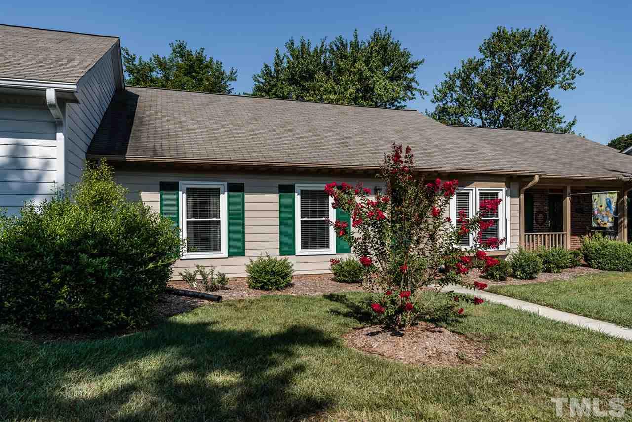 2603 Cottage Circle Raleigh, NC 27613 - Photo 3 of 25 a front view of a house with garden