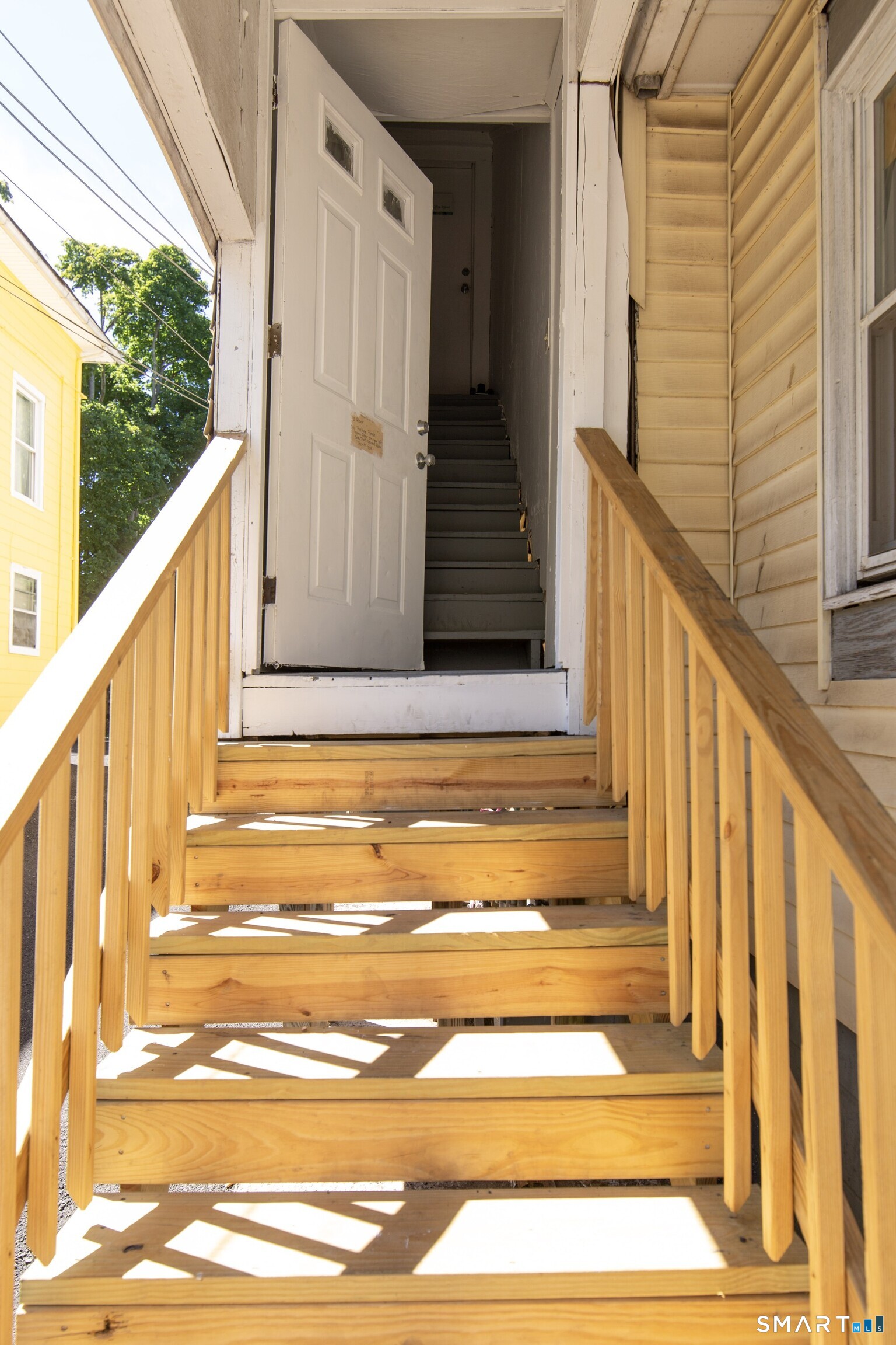 102 Franklin Street Meriden, CT 06450 - Photo 3 of 3 a view of balcony with wooden floor and door