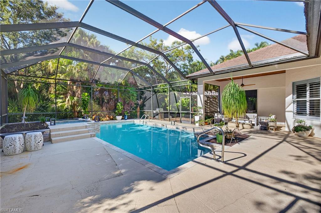 2229 Goshawk Court Naples, FL 34105 - Photo 22 of 29 a view of swimming pool with outdoor seating