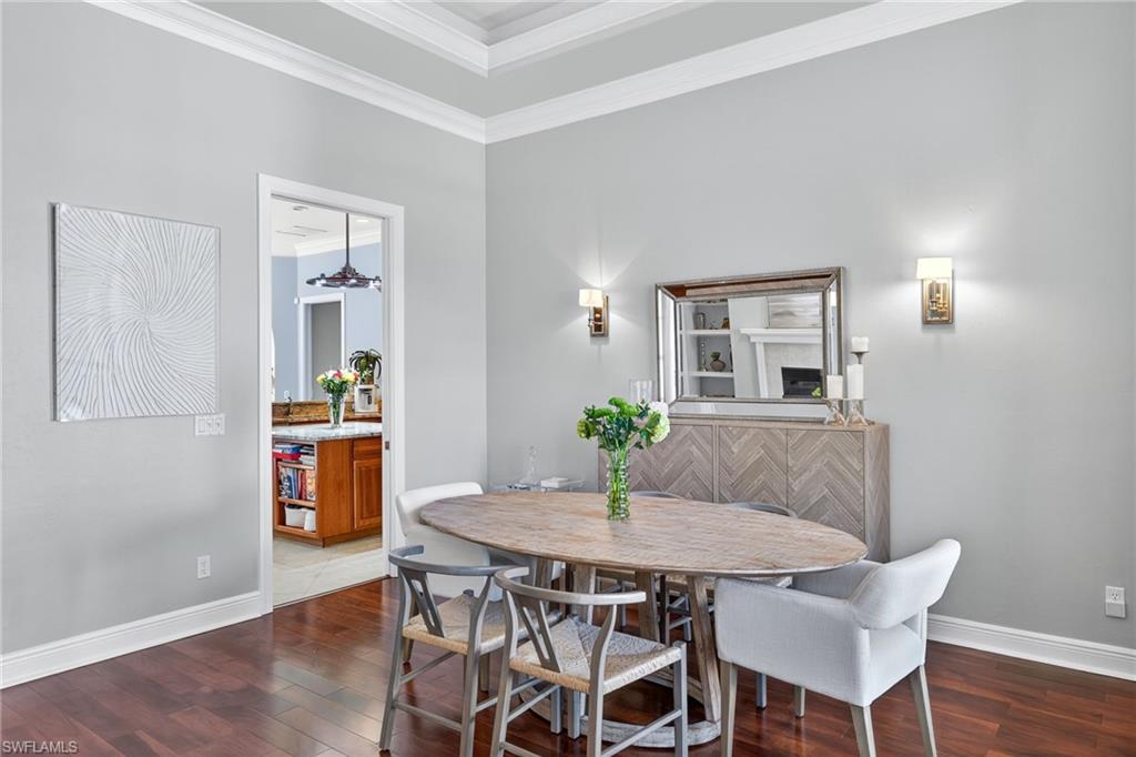 2229 Goshawk Court Naples, FL 34105 - Photo 9 of 29 a view of a dining room with furniture and wooden floor