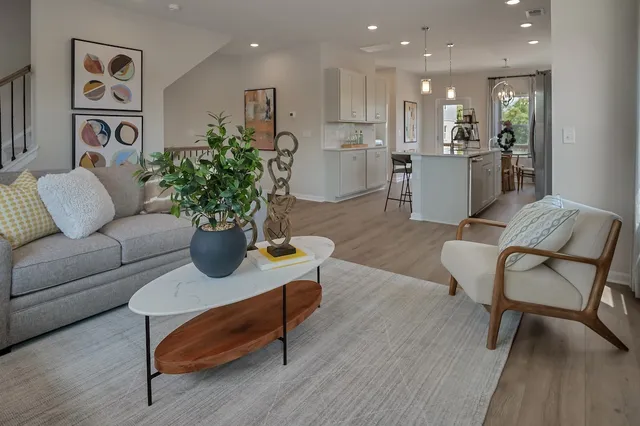 a dining room with furniture and chandelier