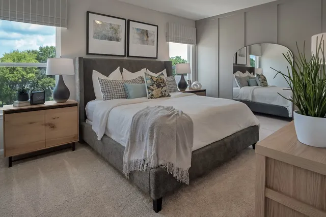 a room with a table chairs and book shelf
