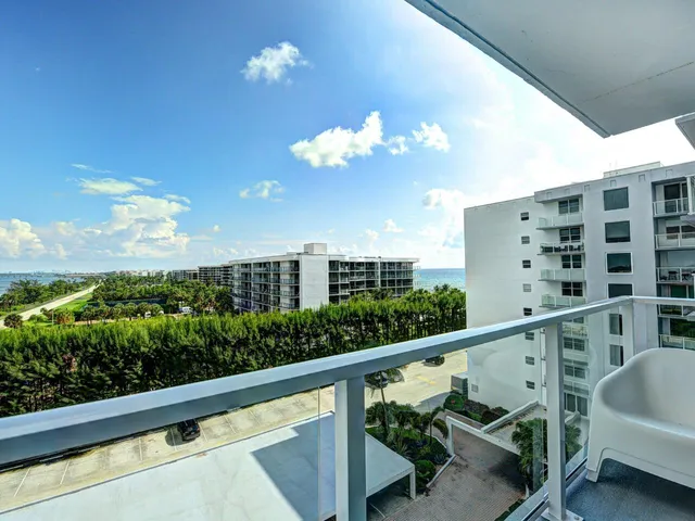 a view of a balcony with wooden floor