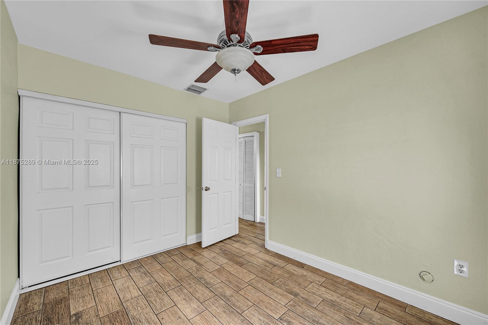 17130 Northeast 7th Avenue North Miami Beach, FL 33162 - Photo 19 of 38 wooden floor in an empty room