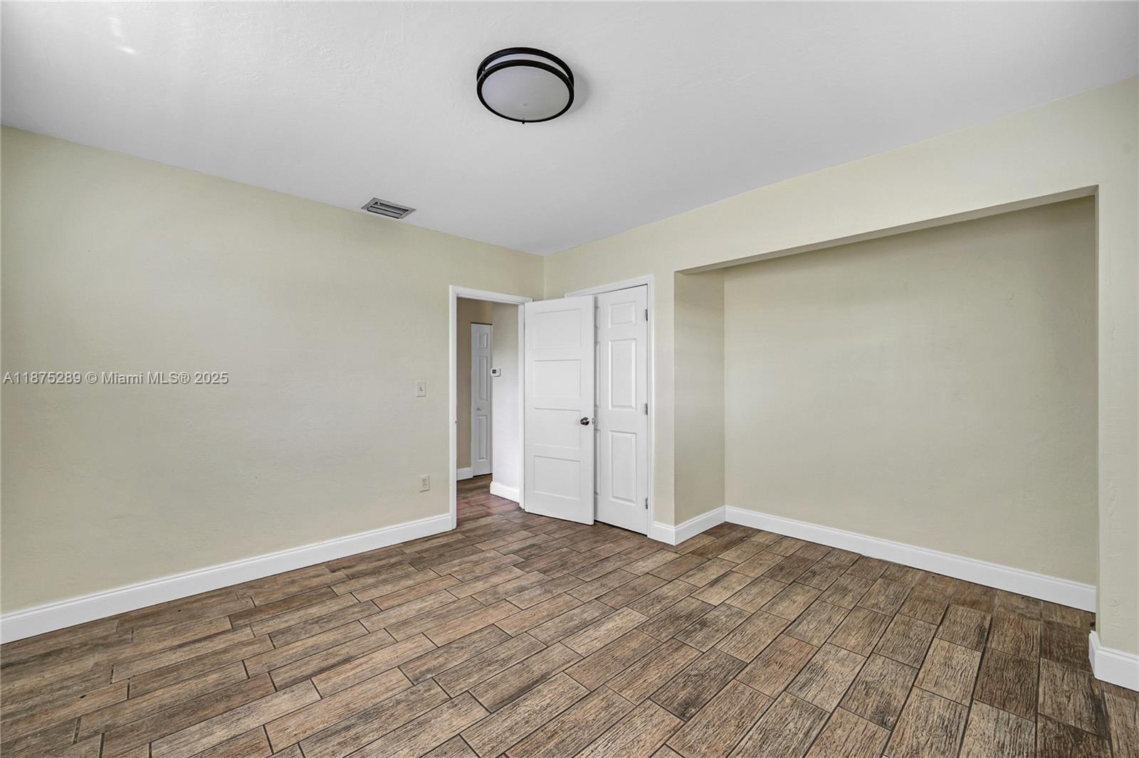 17130 Northeast 7th Avenue North Miami Beach, FL 33162 - Photo 21 of 38 a view of a room with wooden floor