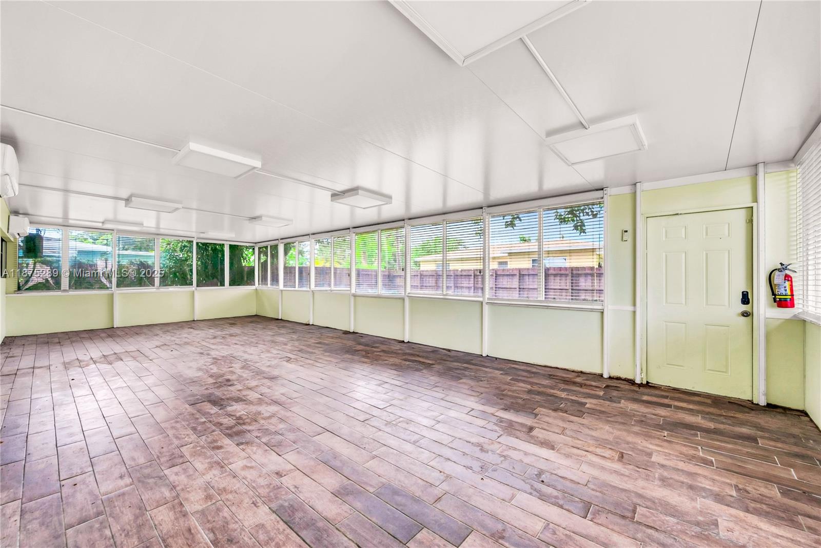 17130 Northeast 7th Avenue North Miami Beach, FL 33162 - Photo 23 of 38 a view of an empty room with a window
