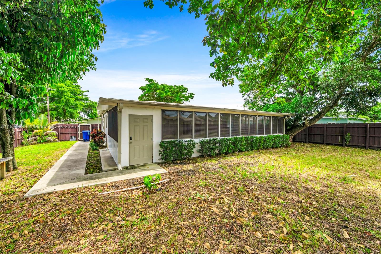 17130 Northeast 7th Avenue North Miami Beach, FL 33162 - Photo 27 of 38 front view of a house with a yard