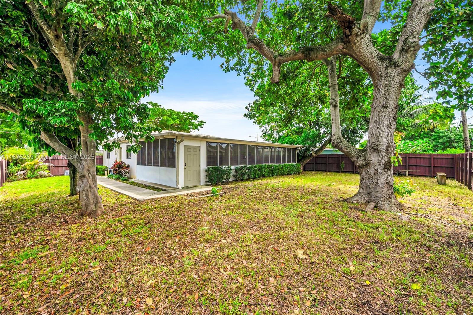 17130 Northeast 7th Avenue North Miami Beach, FL 33162 - Photo 28 of 38 a view of a house with backyard and a tree