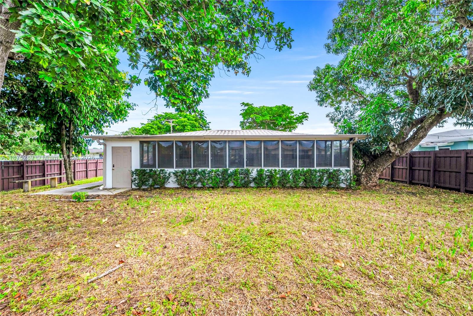 17130 Northeast 7th Avenue North Miami Beach, FL 33162 - Photo 33 of 38 a view of a house with a backyard and a patio