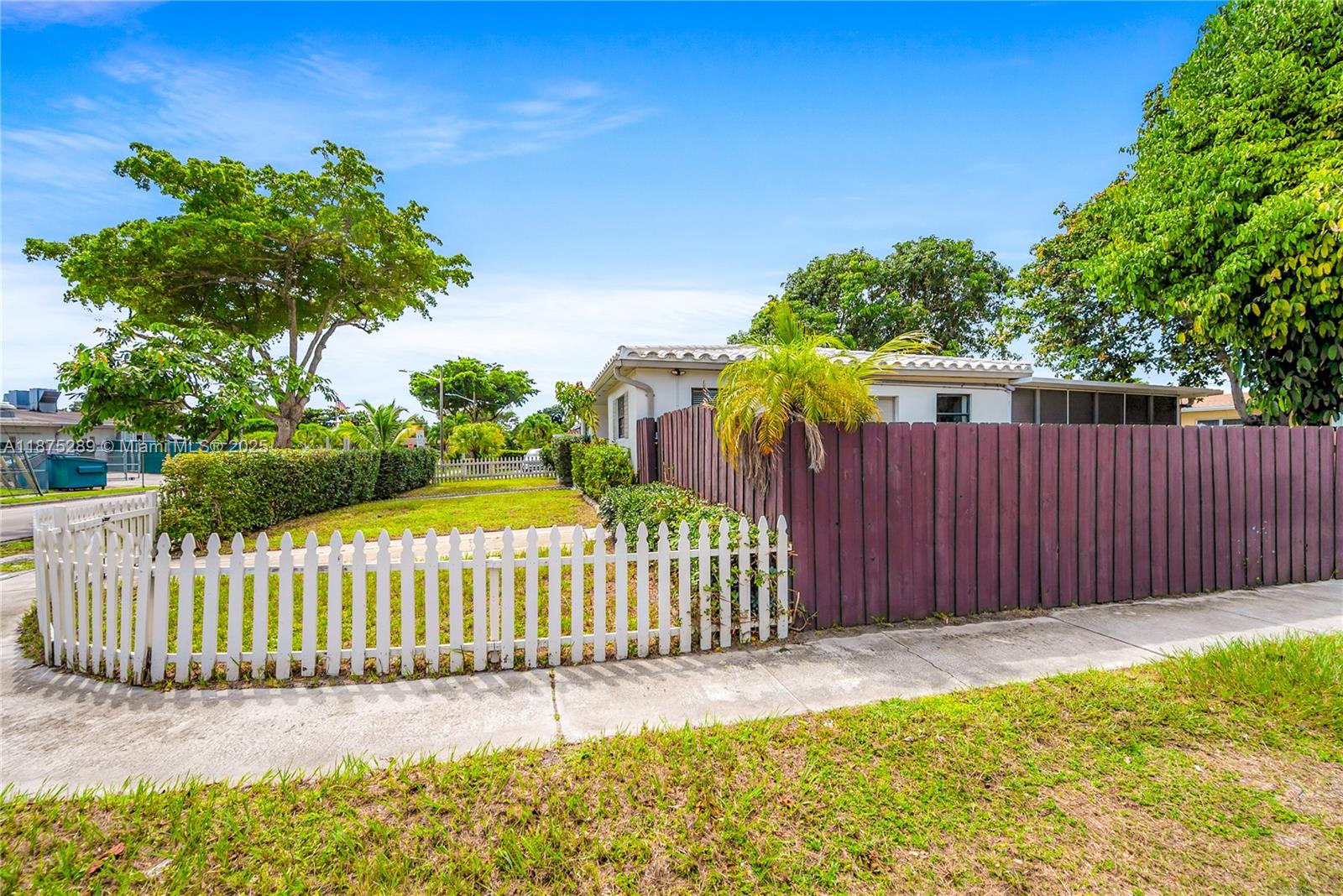 17130 Northeast 7th Avenue North Miami Beach, FL 33162 - Photo 37 of 38 a view of a garden with wooden fence