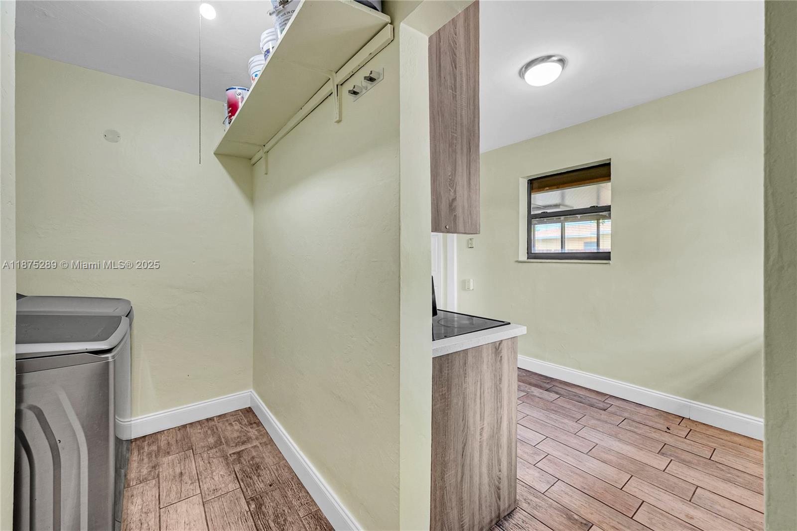 17130 Northeast 7th Avenue North Miami Beach, FL 33162 - Photo 9 of 38 a view of hallway with wooden floor