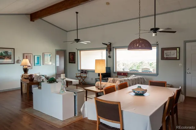 a kitchen with a sink cabinets and wooden floor