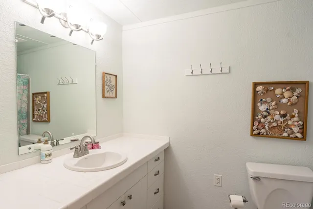 a bathroom with a double vanity sink mirror and double