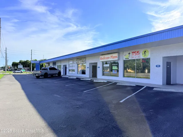 a view of a car park in front of house