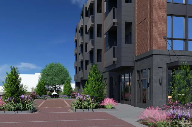 a view of a building with a yard