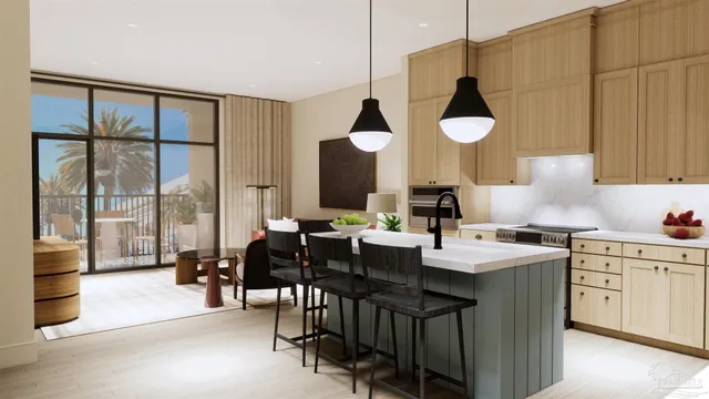 a kitchen with a sink cabinets and wooden floor